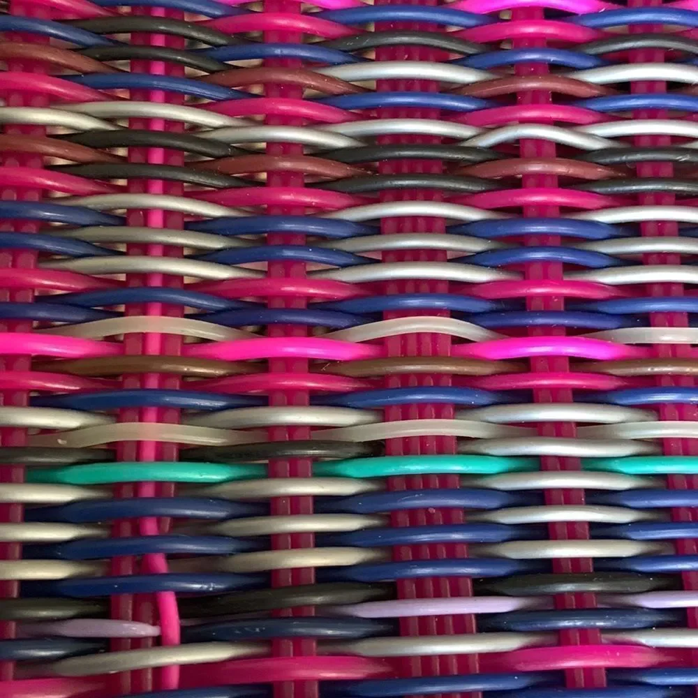 Handwoven plastic bag in multicolor with pink bottom and pink handles